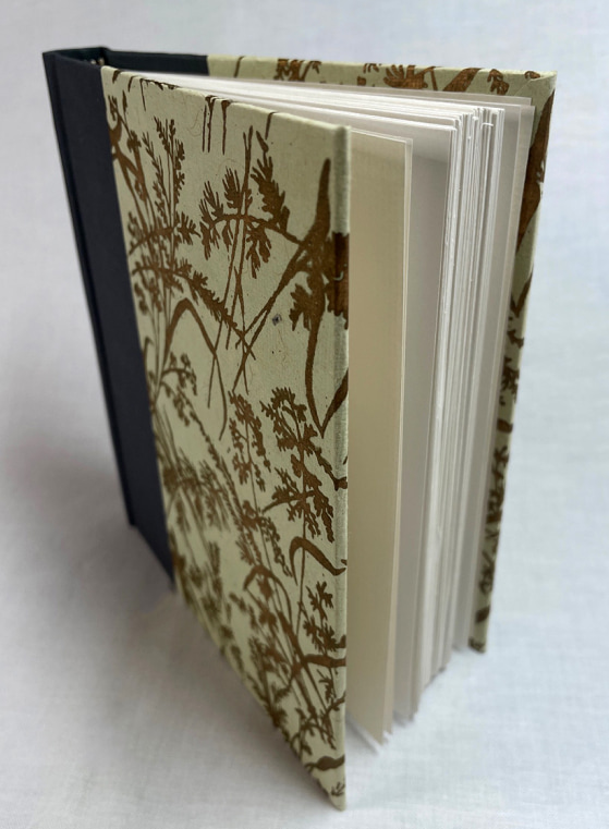 late fall sketchbook closed, lying on its side